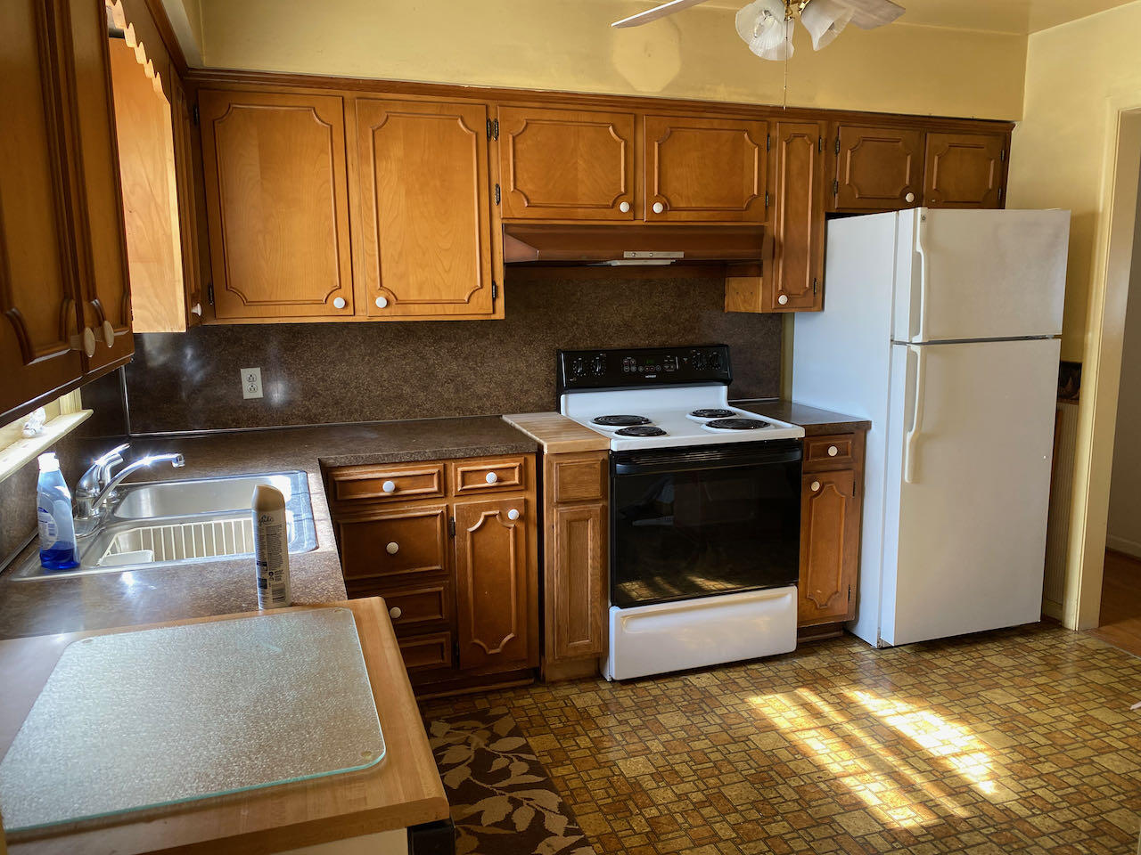 610 Olney Road Vinton, VA 24179 - Photo 9 of 42 a kitchen with granite countertop a refrigerator a stove a sink and a microwave