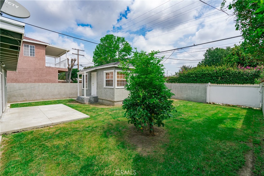 6786 Delta Avenue Long Beach, CA 90805 - Photo 11 of 16 a view of backyard of house with green space