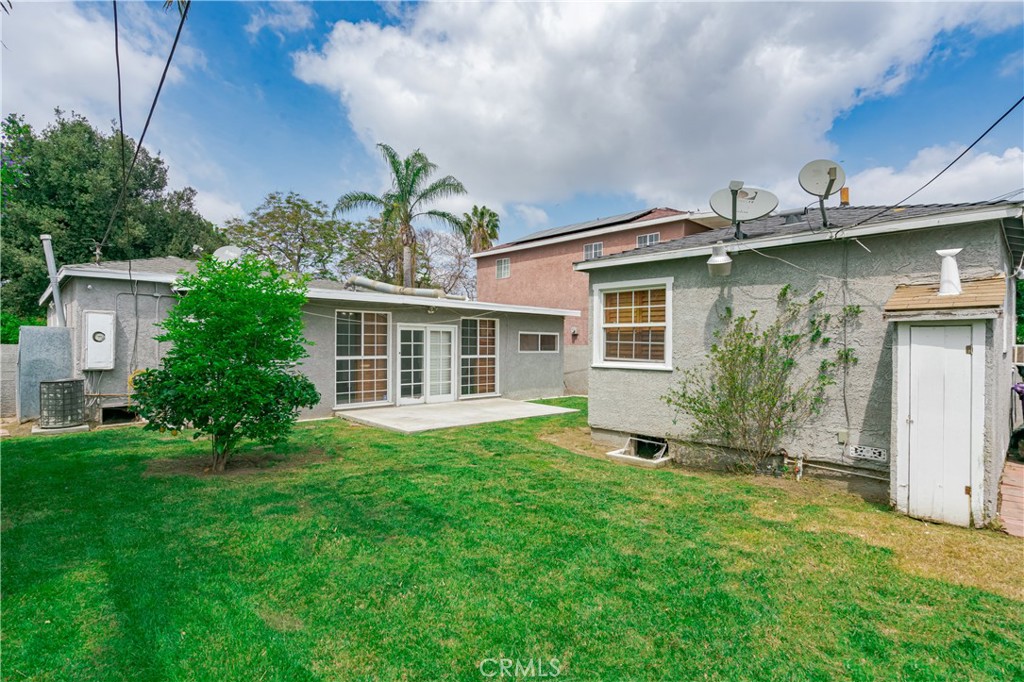 6786 Delta Avenue Long Beach, CA 90805 - Photo 16 of 16 a front view of a house with a yard