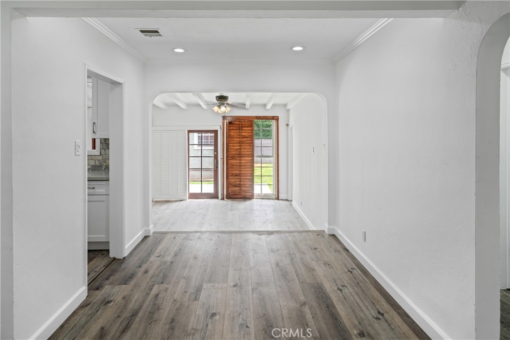 6786 Delta Avenue Long Beach, CA 90805 - Photo 2 of 16 wooden floor in an empty room with a window