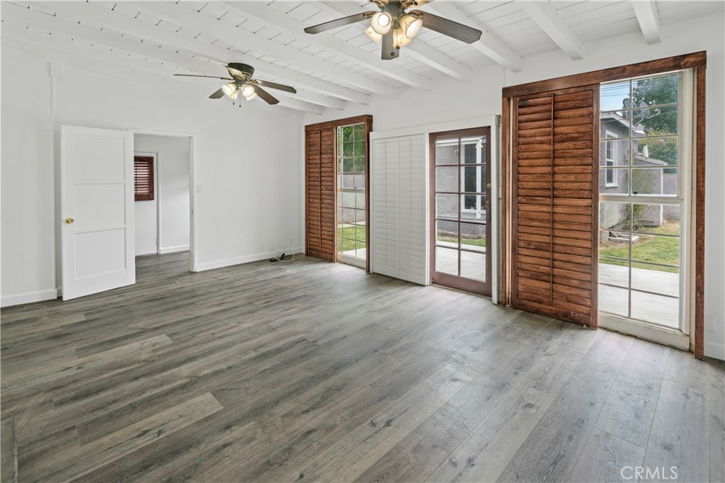 6786 Delta Avenue Long Beach, CA 90805 - Photo 9 of 16 a view of empty room with wooden floor and fan