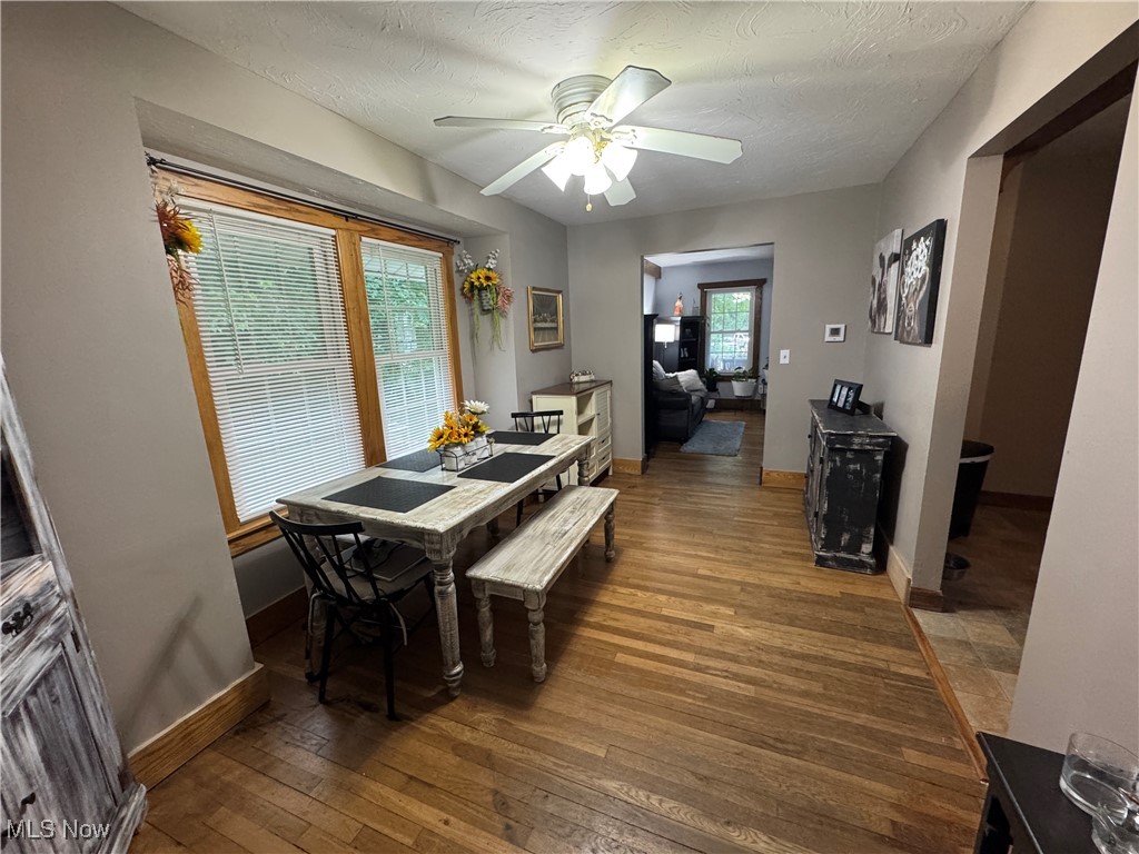 5322 Lockwood Road Madison, OH 44057 - Photo 14 of 30 Dining space with wood-type flooring, a textured ceiling, and ceiling fan