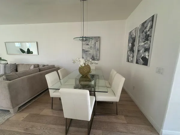 a dining room with furniture and window