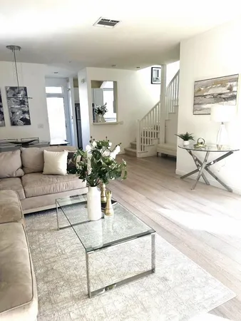 a living room with furniture and a table