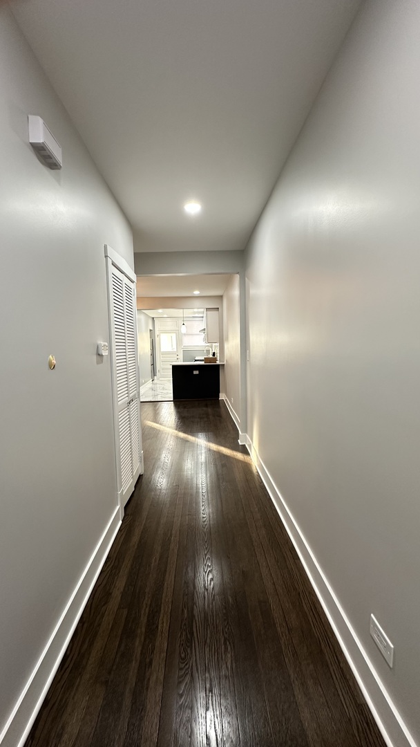 5224 North Bernard Street, Unit 2 Chicago, IL 60625 - Photo 5 of 13 an empty room with wooden floor and entrance