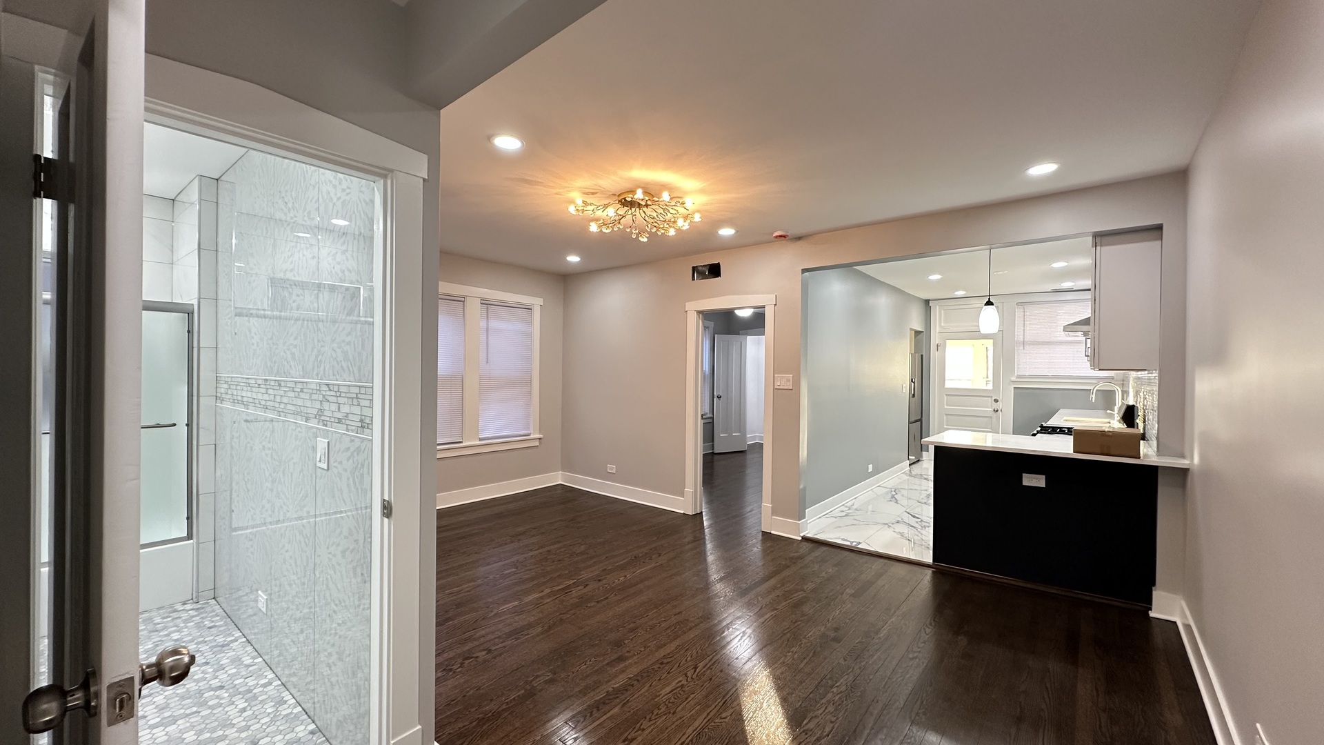 5224 North Bernard Street, Unit 2 Chicago, IL 60625 - Photo 6 of 13 a view of a hallway with wooden floor and a cabinet