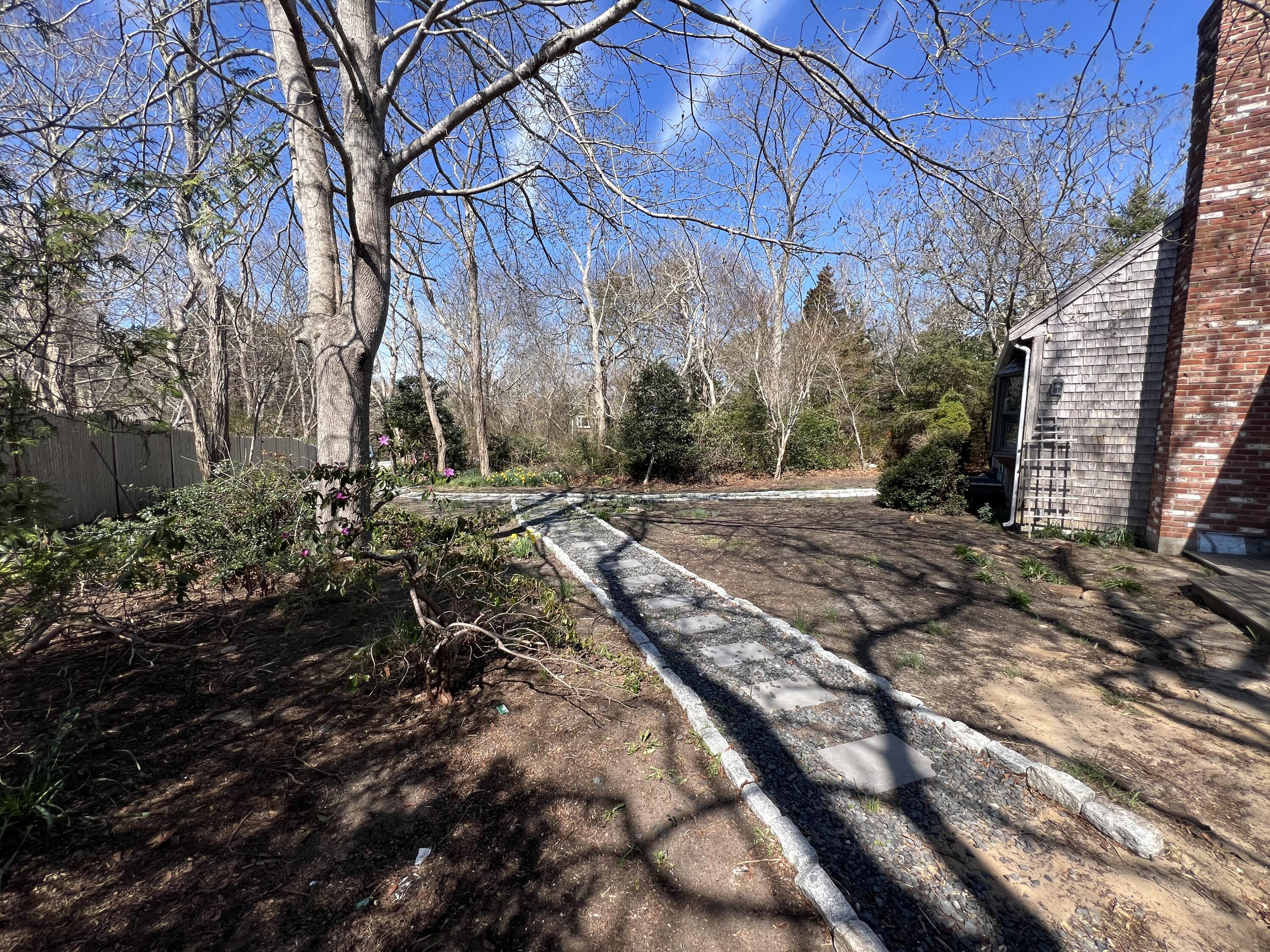 140 Harvest Road Eastham, MA 02642 - Photo 12 of 25 a backyard of a house