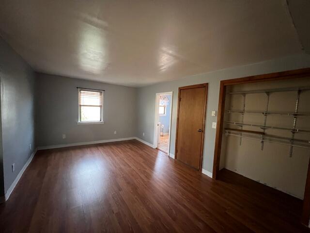 140 Harvest Road Eastham, MA 02642 - Photo 17 of 25 an empty room with wooden floor and windows