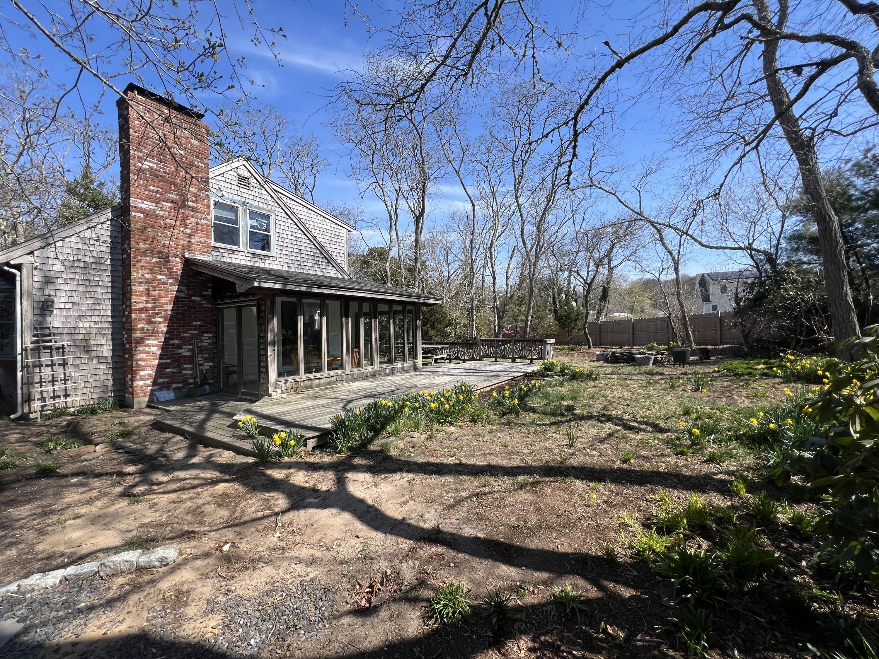 140 Harvest Road Eastham, MA 02642 - Photo 22 of 25 a view of house with backyard and trees