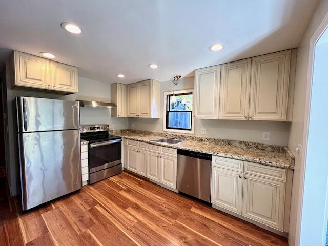 140 Harvest Road Eastham, MA 02642 - Photo 5 of 25 a kitchen with granite countertop stainless steel appliances and wooden cabinets