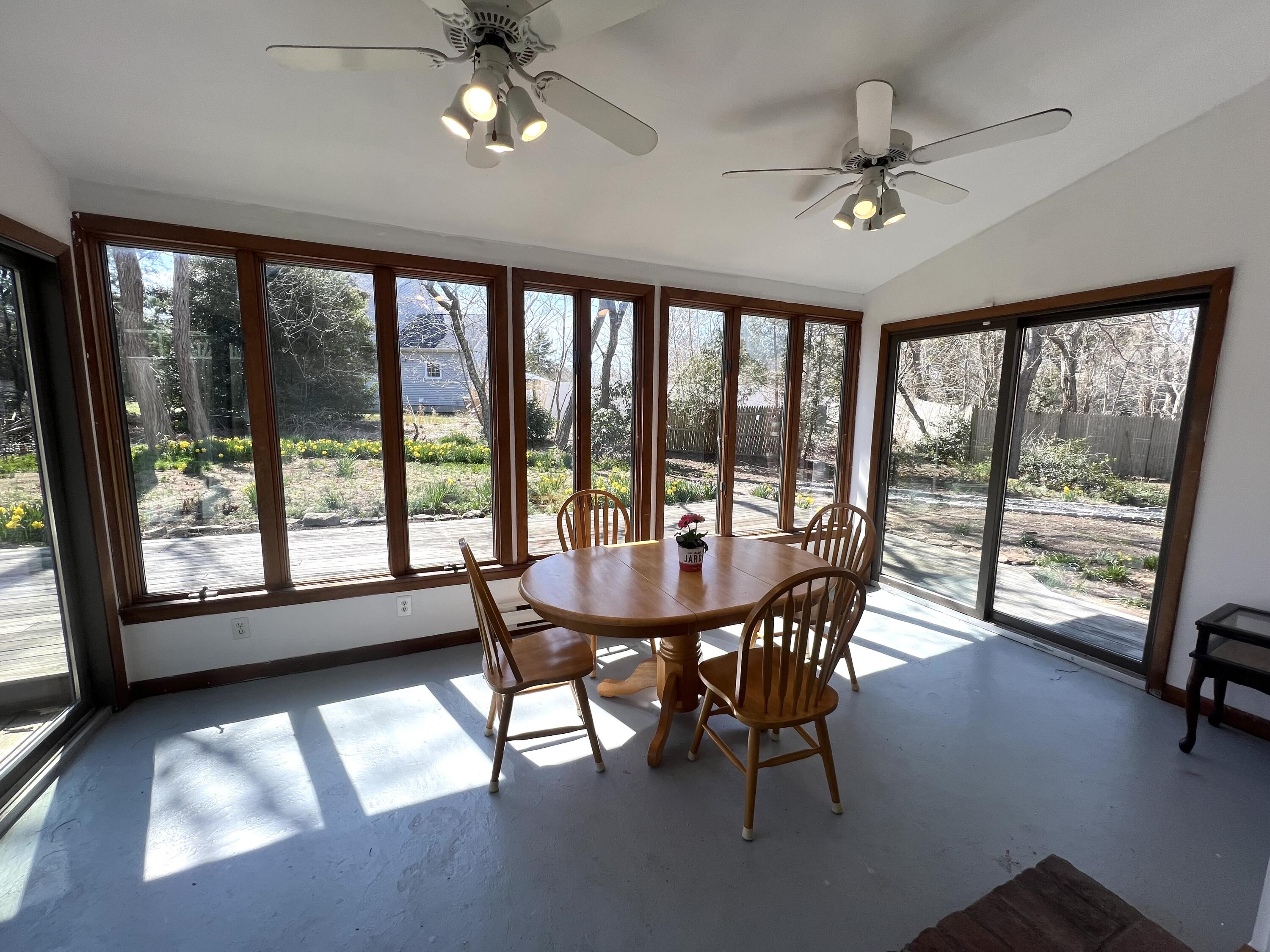 140 Harvest Road Eastham, MA 02642 - Photo 8 of 25 a view of a dining room with furniture window and outside view