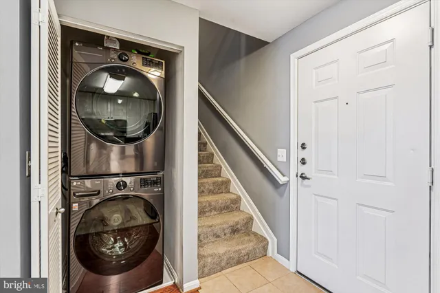 a living room with furniture rug and a window