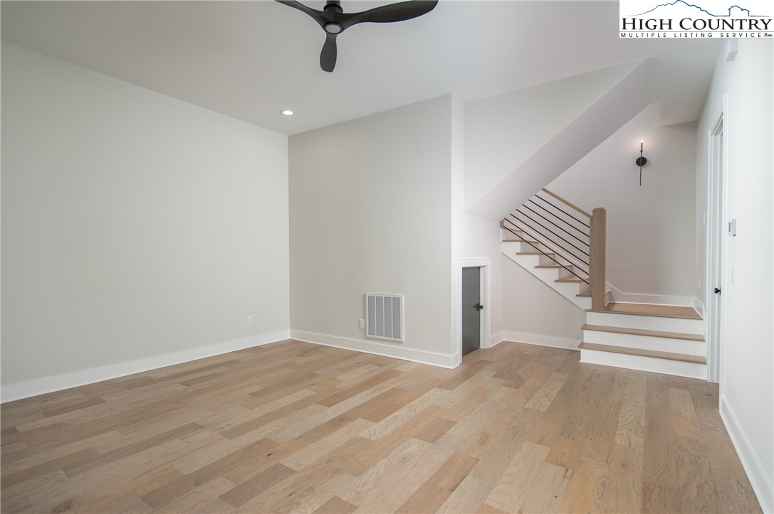 353 Calico Court Boone, NC 28607 - Photo 15 of 50 wooden floor in an empty room with a window