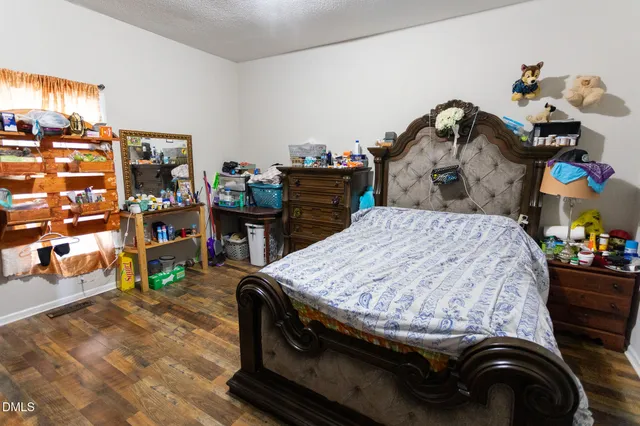 a bed room with a bed and a book shelf