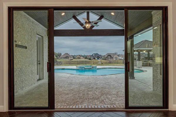 a view of swimming pool with a yard