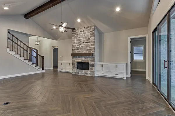 a kitchen with stainless steel appliances granite countertop a sink a stove and a refrigerator
