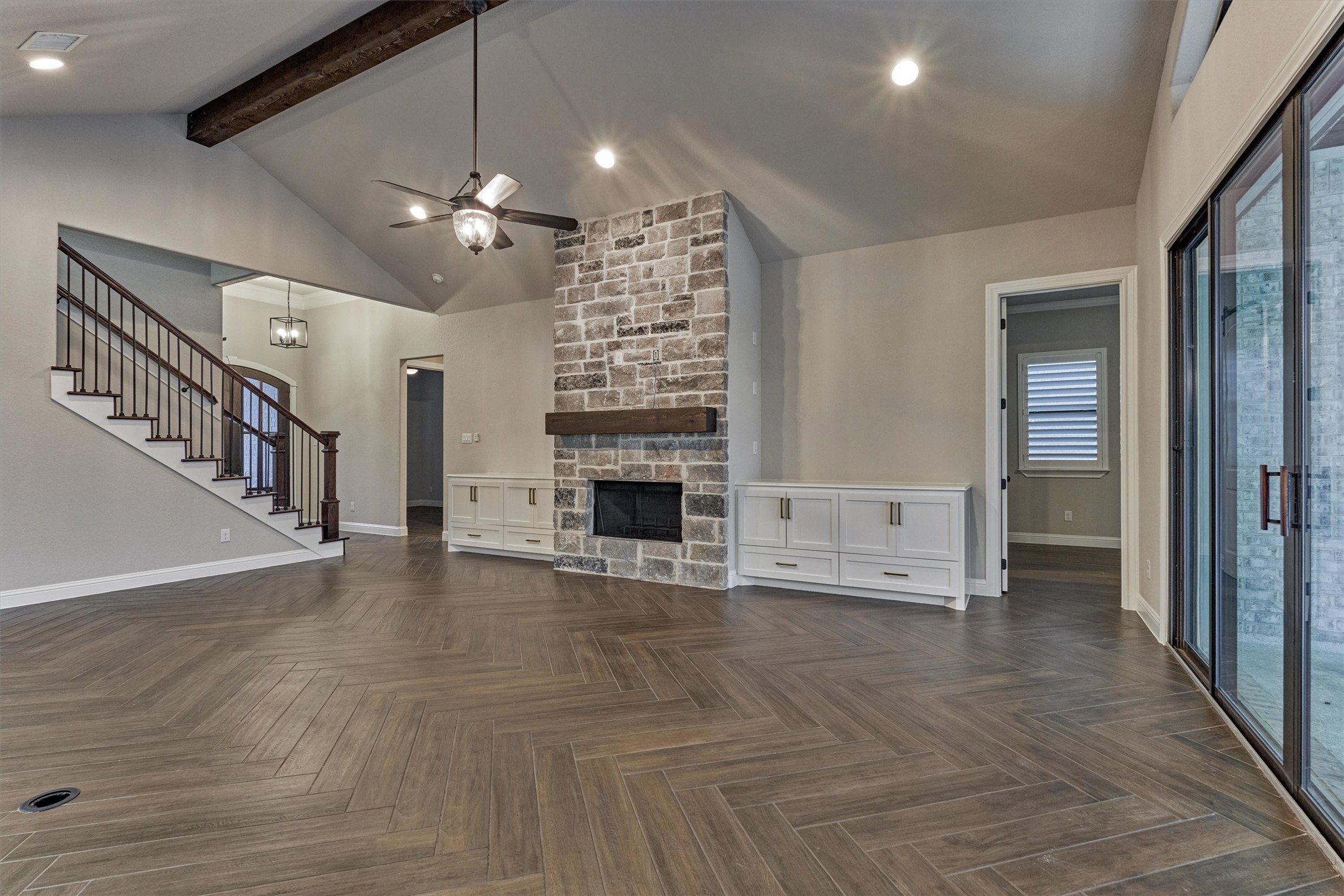 11618 Renaissance Drive Montgomery, TX 77356 - Photo 13 of 48 an empty room with wooden floor fireplace and staircase