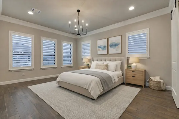 a spacious bathroom with a tub sink and mirror