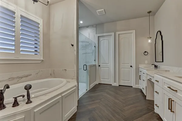 a bathroom with a double vanity sink mirror and