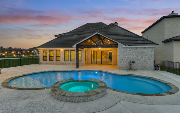 a front view of a house with swimming pool