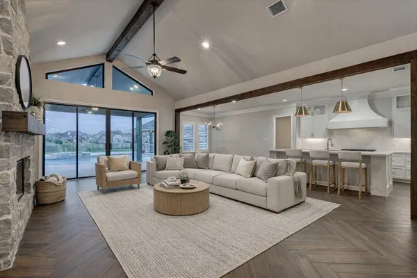 a view of an empty room with a fireplace and a window