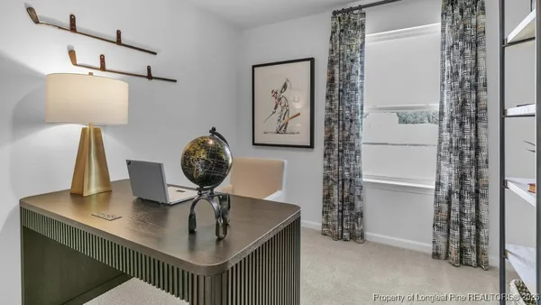 a room with a table and chairs