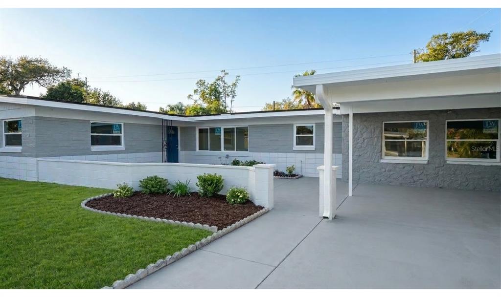 4528 South Shore Road Orlando, FL 32839 - Photo 1 of 2 a front view of a house with a yard
