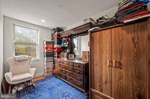 a view of a room with furniture and windows