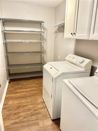 a view of storage and utility room with washer and dryer
