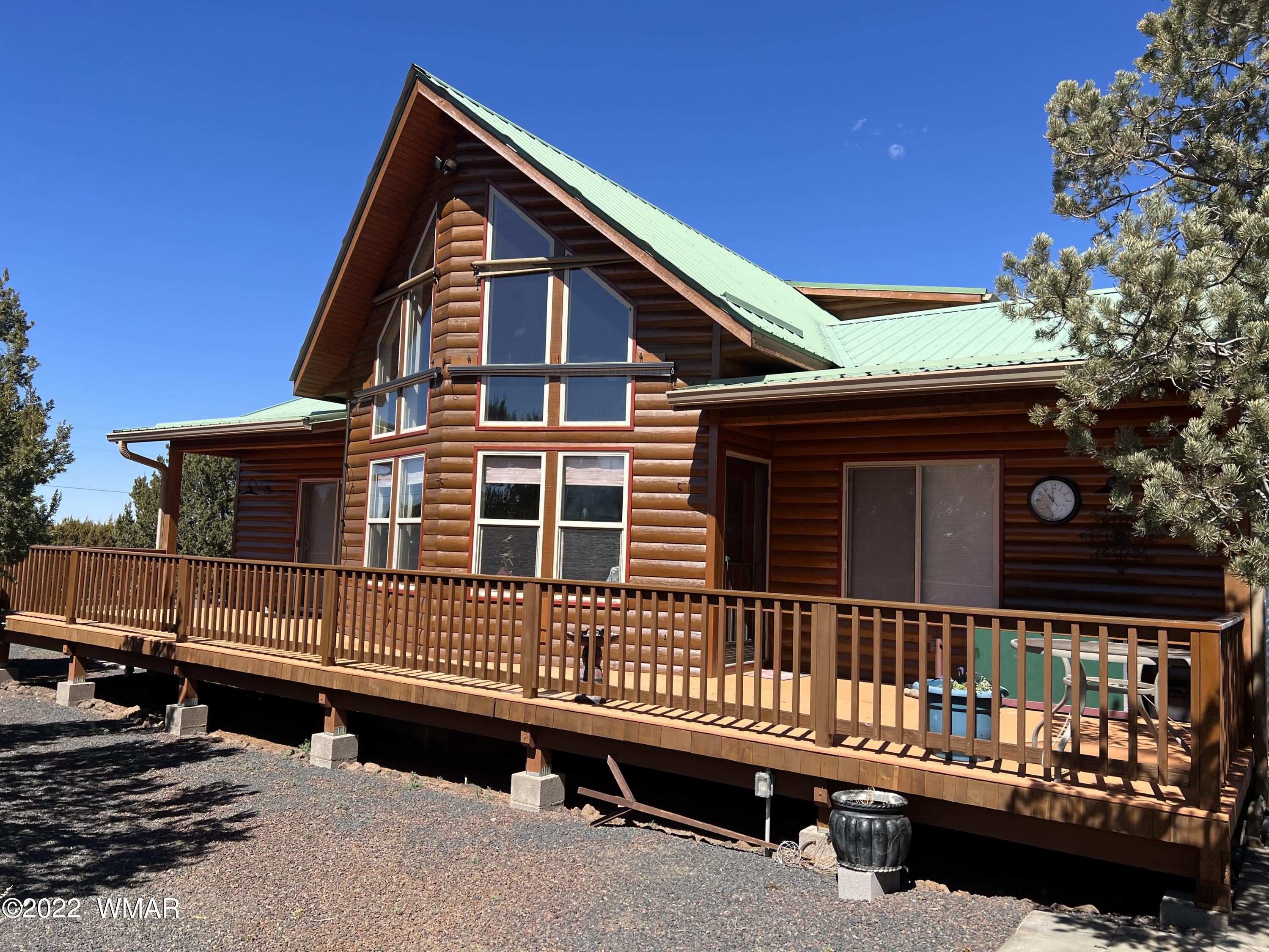 7 County Road Concho, AZ 85924 - Photo 1 of 21 a front view of a house with a deck