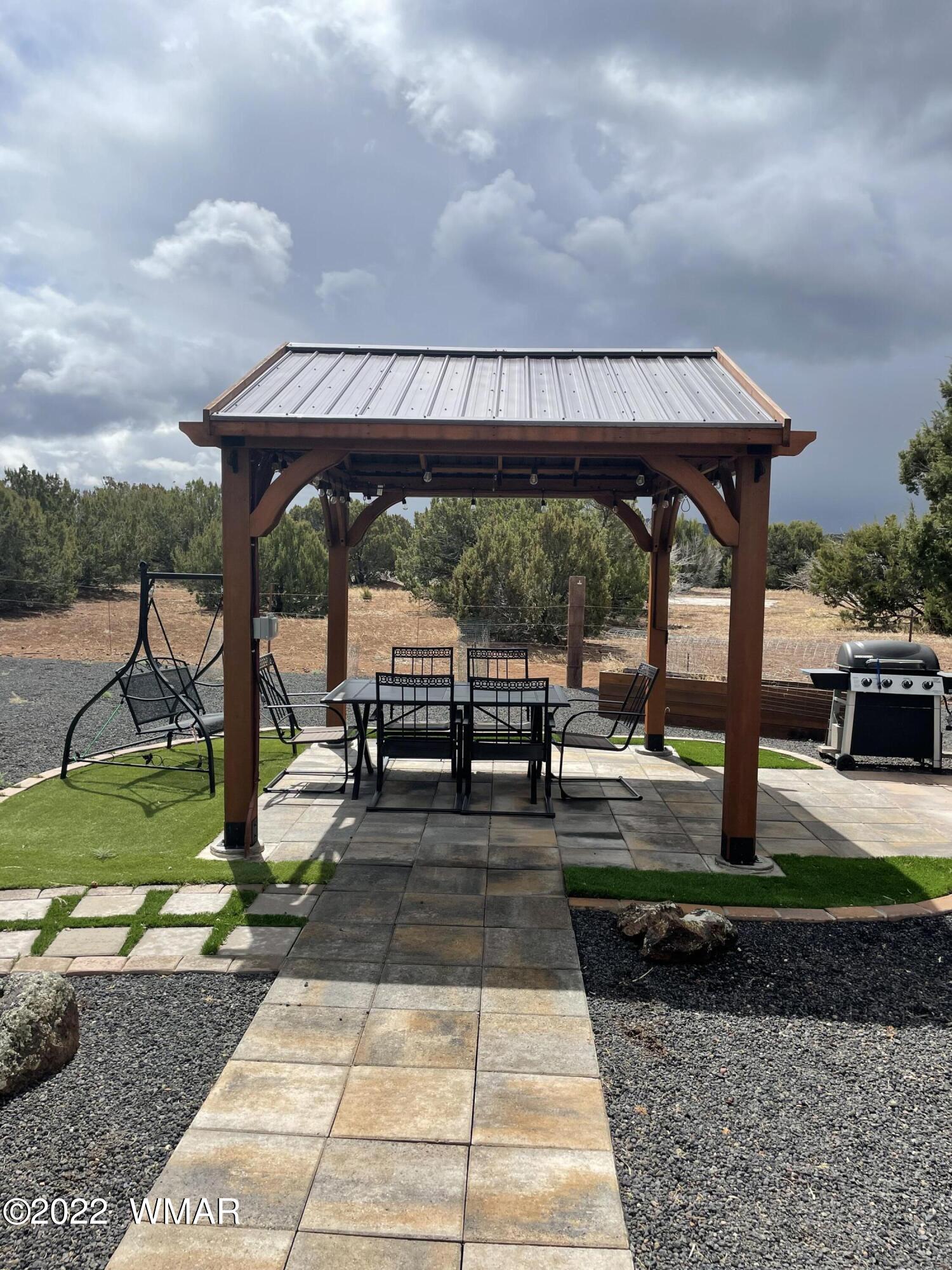 7 County Road Concho, AZ 85924 - Photo 12 of 21 a view of a backyard with sitting area