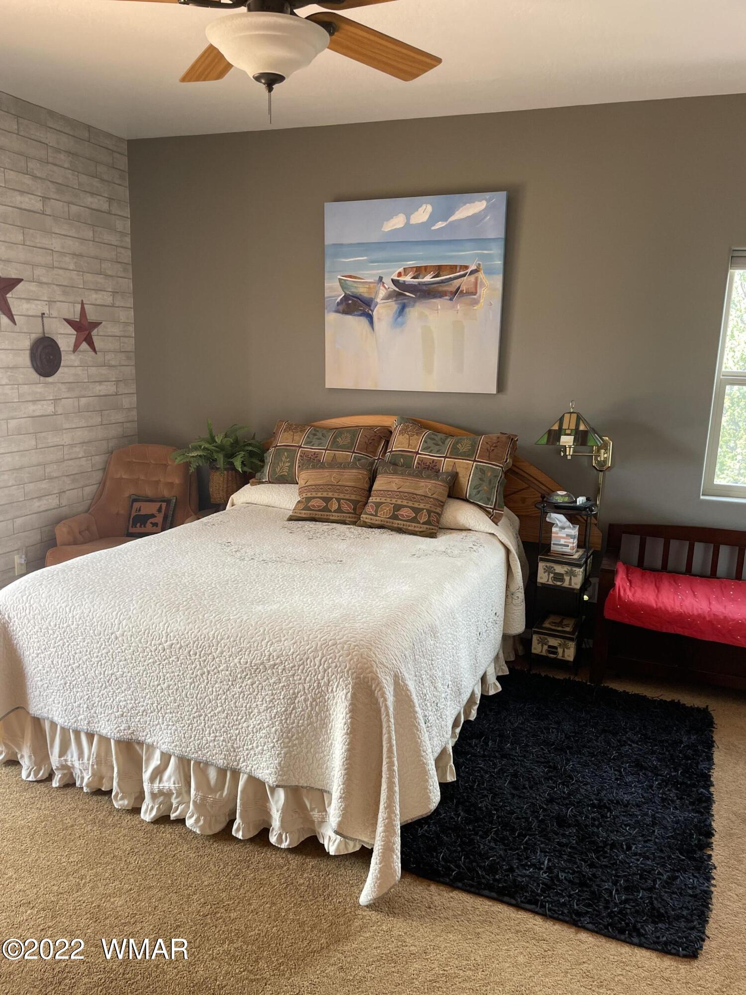 7 County Road Concho, AZ 85924 - Photo 13 of 21 a bedroom with a bed and a wall painting