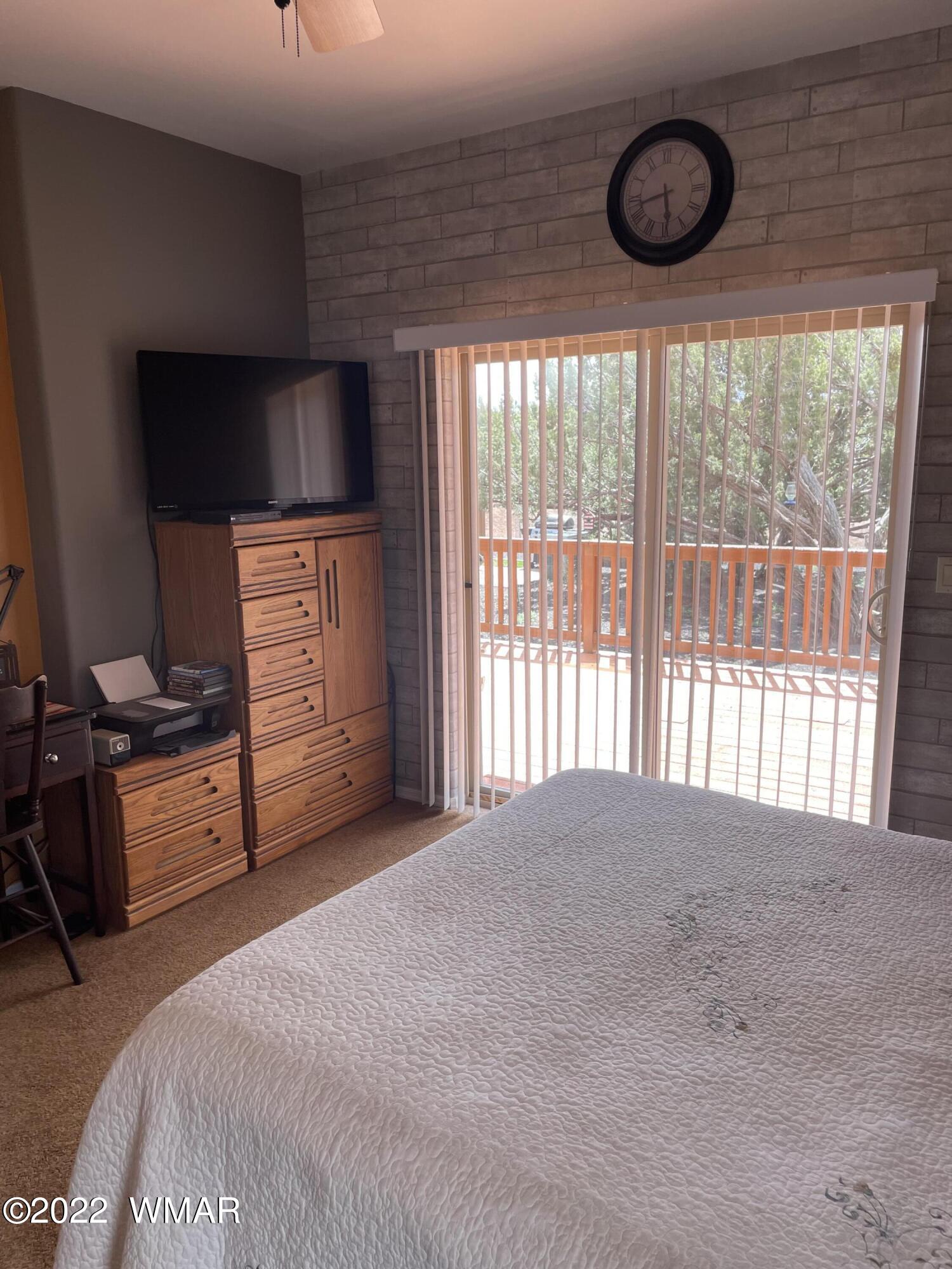 7 County Road Concho, AZ 85924 - Photo 14 of 21 a bedroom with furniture and a flat screen tv