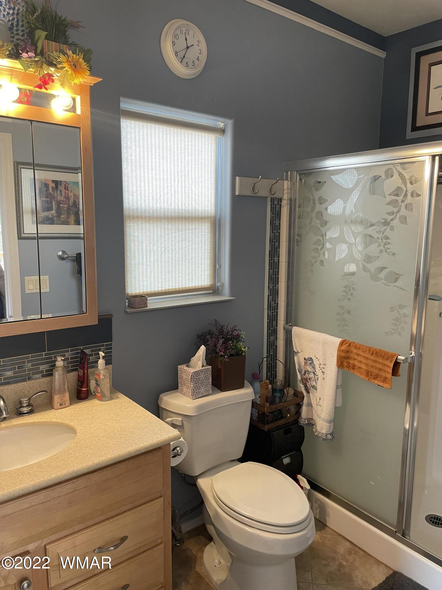 7 County Road Concho, AZ 85924 - Photo 15 of 21 a bathroom with a sink a toilet and a mirror
