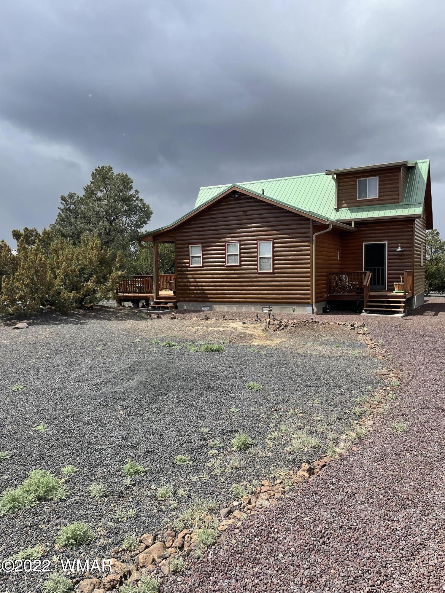 7 County Road Concho, AZ 85924 - Photo 5 of 21 a front view of a house with a yard