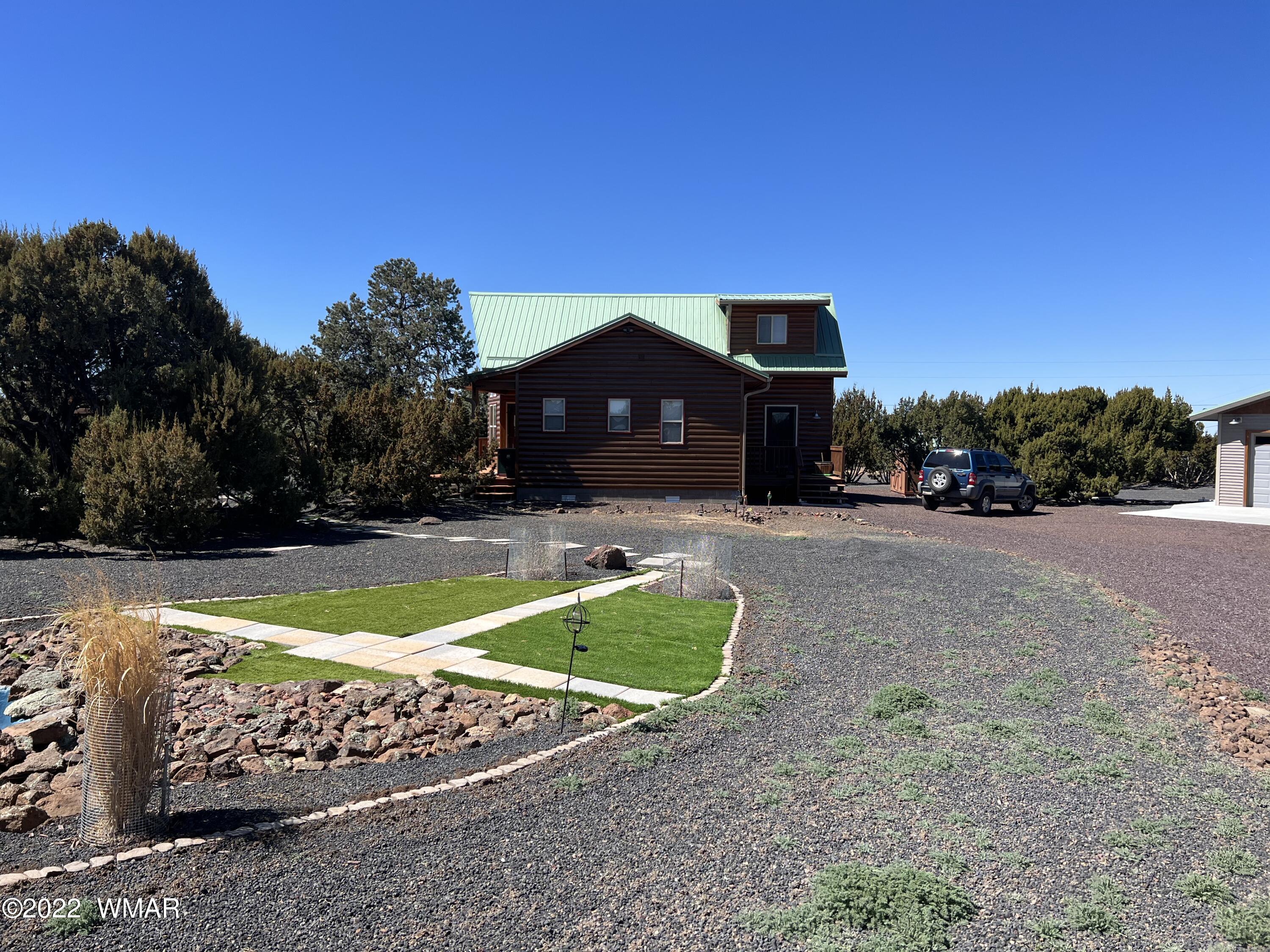 7 County Road Concho, AZ 85924 - Photo 6 of 21 a front view of a house with yard