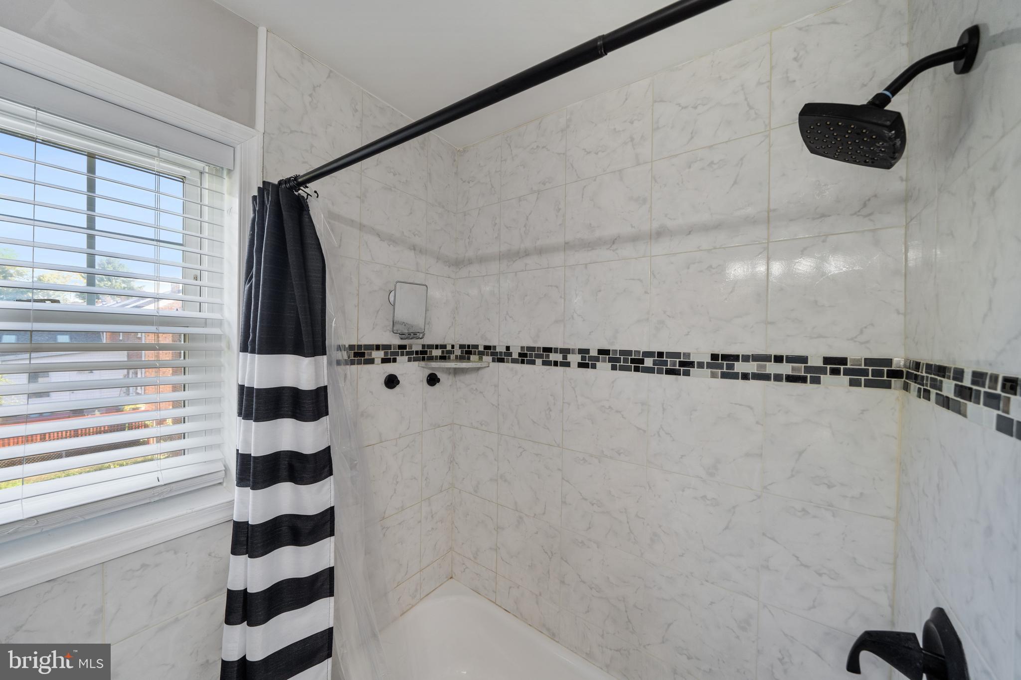 261 East Avon Road Brookhaven, PA 19015 - Photo 23 of 34 a bathroom with a shower