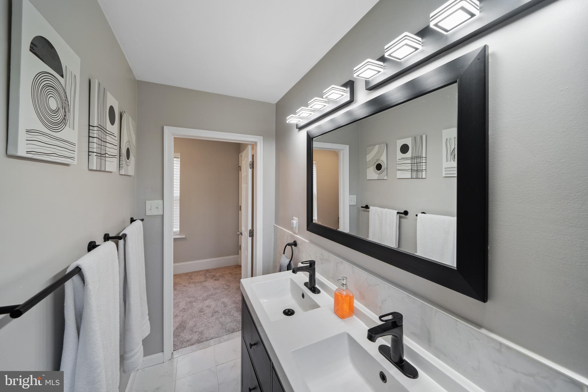 261 East Avon Road Brookhaven, PA 19015 - Photo 24 of 34 a bathroom with a sink and a mirror
