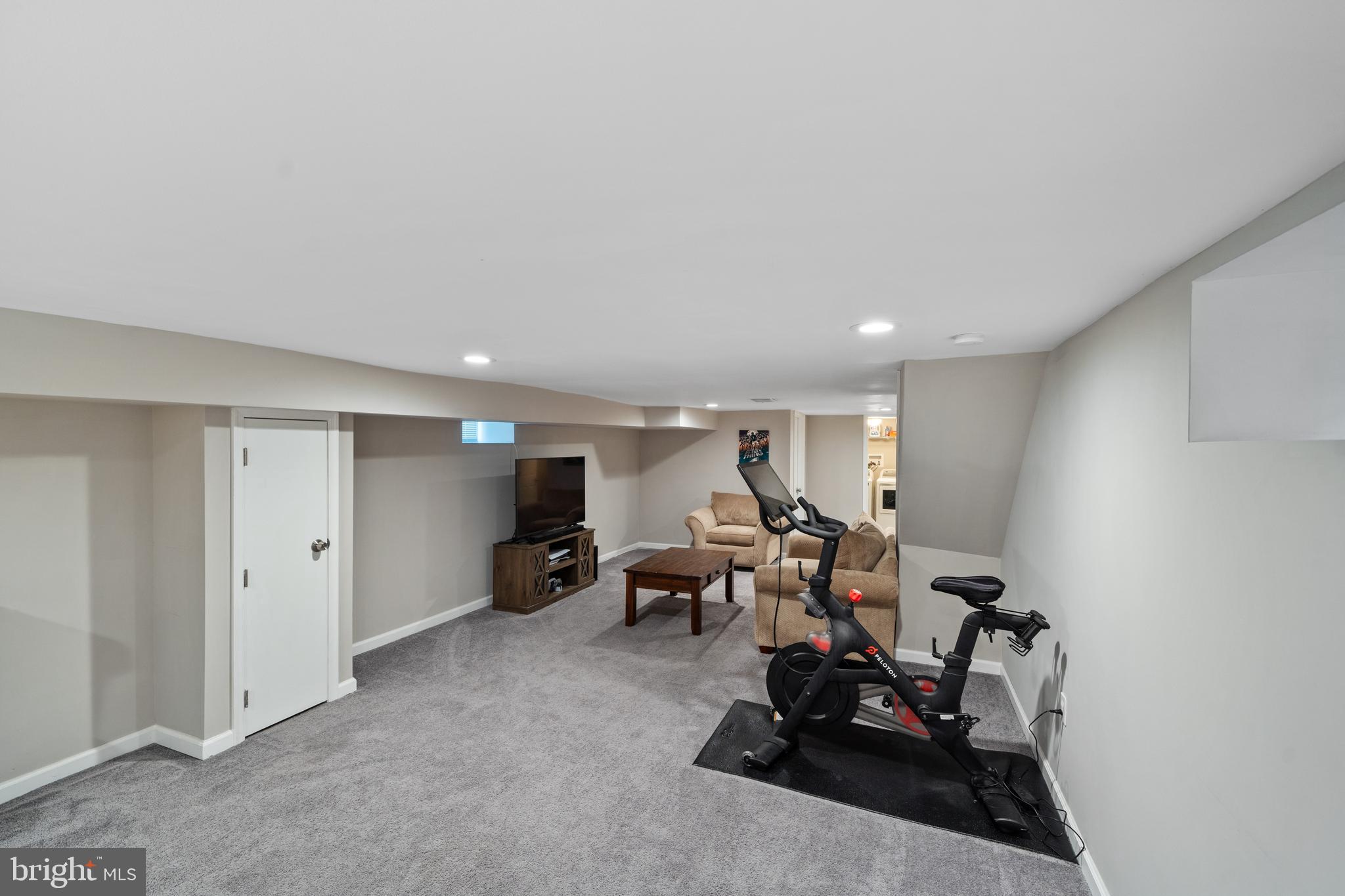 261 East Avon Road Brookhaven, PA 19015 - Photo 28 of 34 a living room with furniture and a gym machine