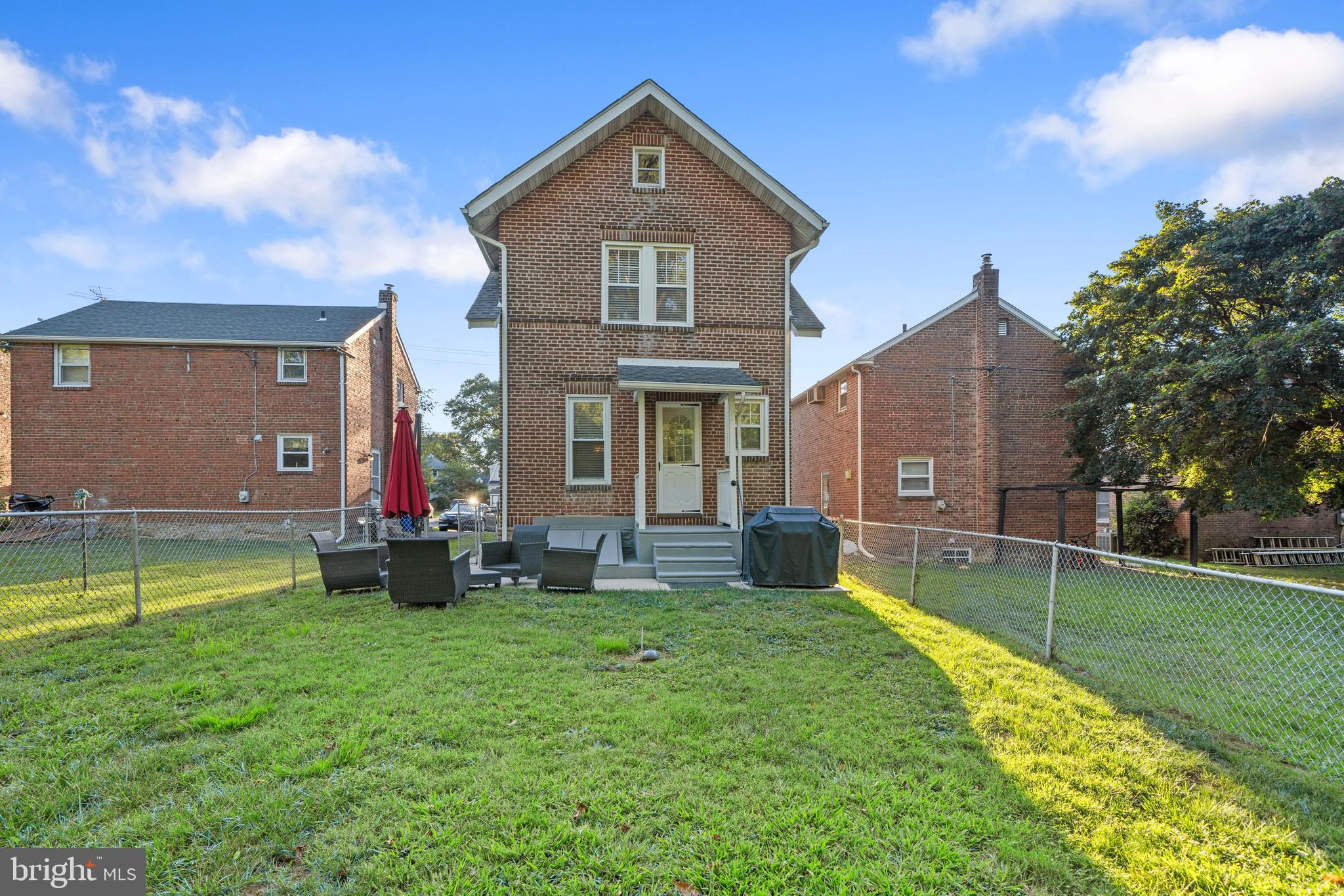 261 East Avon Road Brookhaven, PA 19015 - Photo 32 of 34 a front view of a house with a yard table and chairs