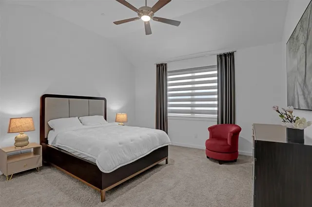 a bedroom with a bed and window