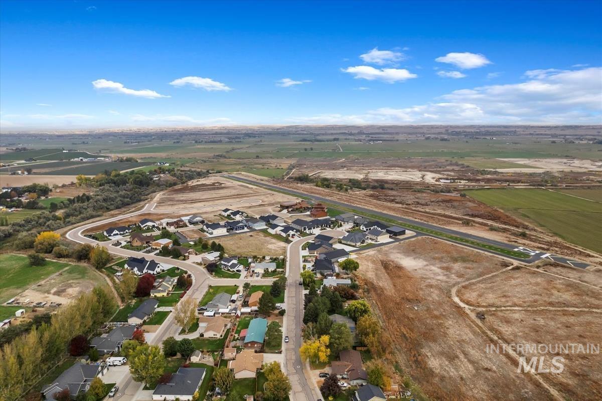 21313 Beechcraft Circle Greenleaf, ID 83626 - Photo 5 of 10 Aerial view of property's location with nearby suburban area and rural landscape