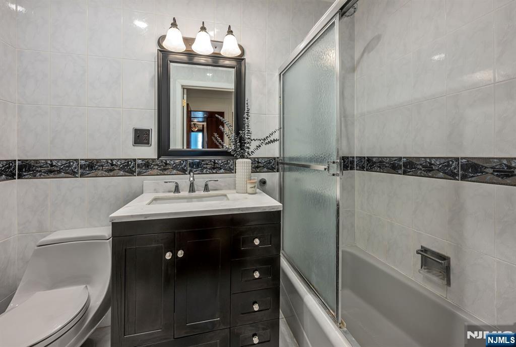 84 Bogerts Mill Road Harrington Park, NJ 07640 - Photo 28 of 47 a bathroom with a sink and a mirror