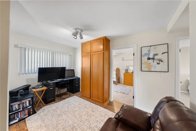 a bedroom with furniture and a window