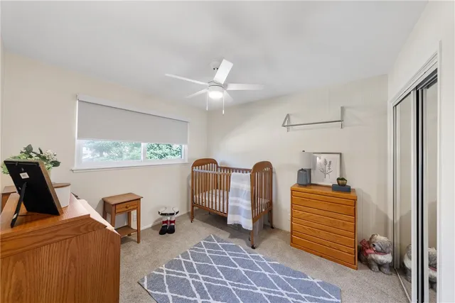 a bedroom with furniture and a window