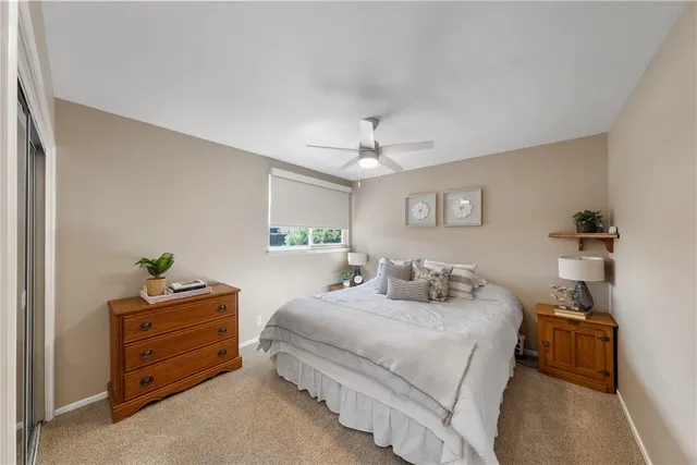 a bedroom with a bed and a dresser