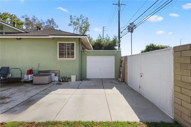 a view of a house with backyard porch and sitting area