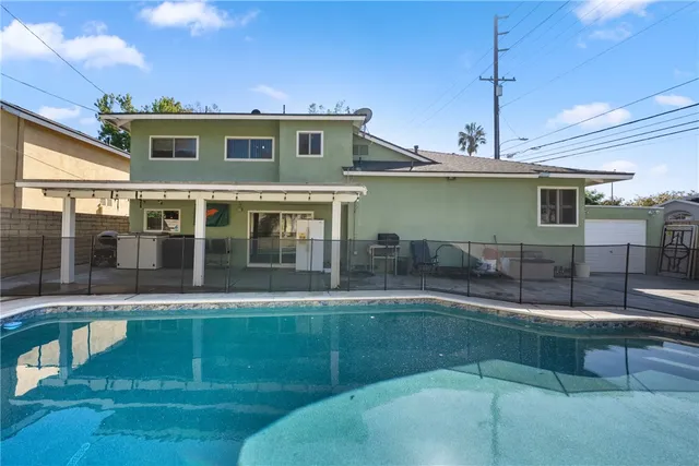 a view of a swimming pool with a patio