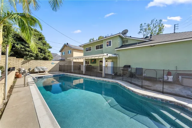a view of a swimming pool with a patio
