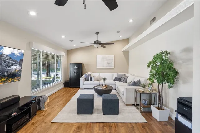 a living room with furniture fireplace and flat screen tv